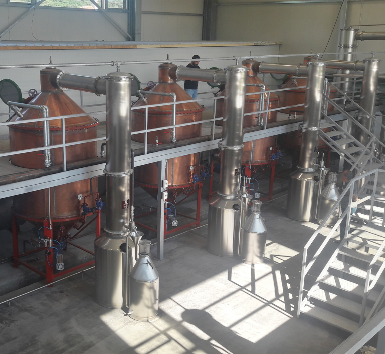 Copper rose oil distillation stills with a stainless steel service platform
