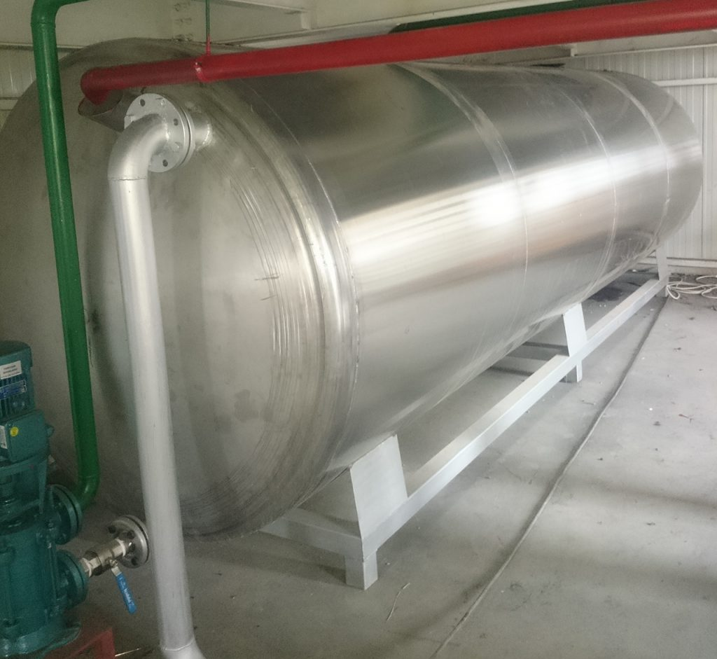 Horizontal stainless steel tank on steel supports
