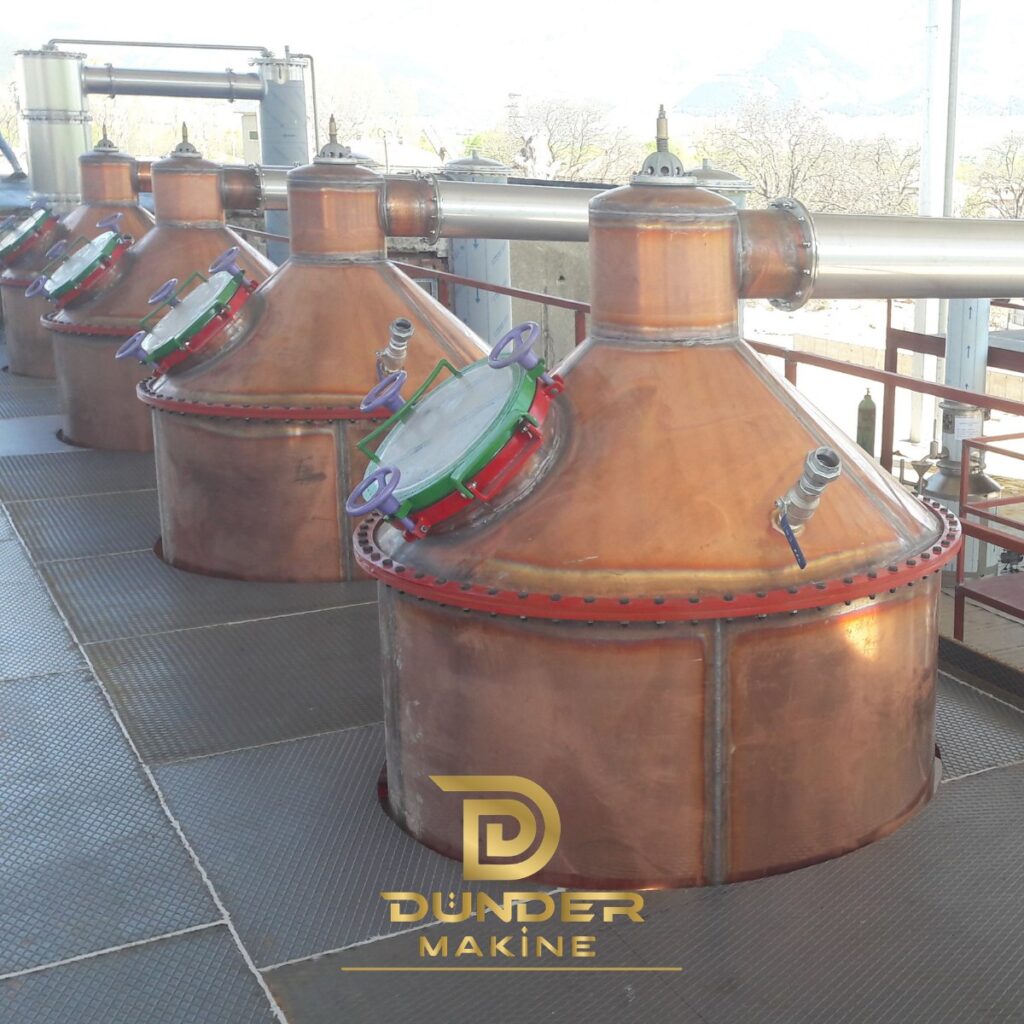 Quick opening manhole with hand wheels and hinged cover on copper distillation stills